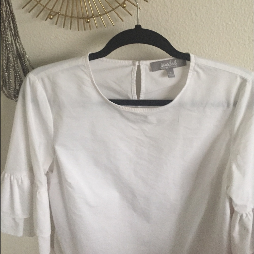 White linen ruffled shirt.